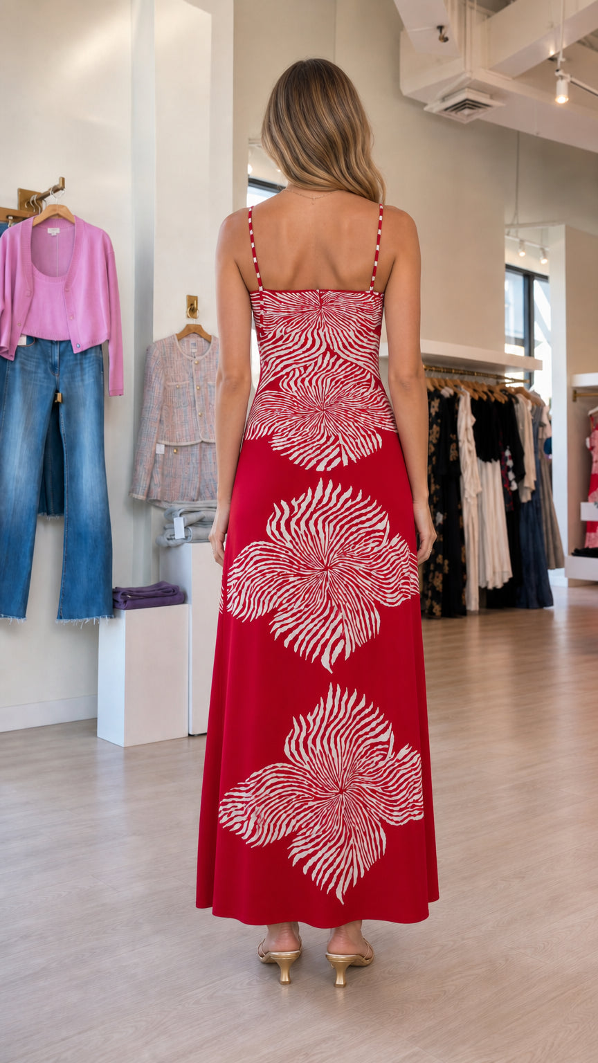 Back view of model showcasing the back design of the red maxi dress
