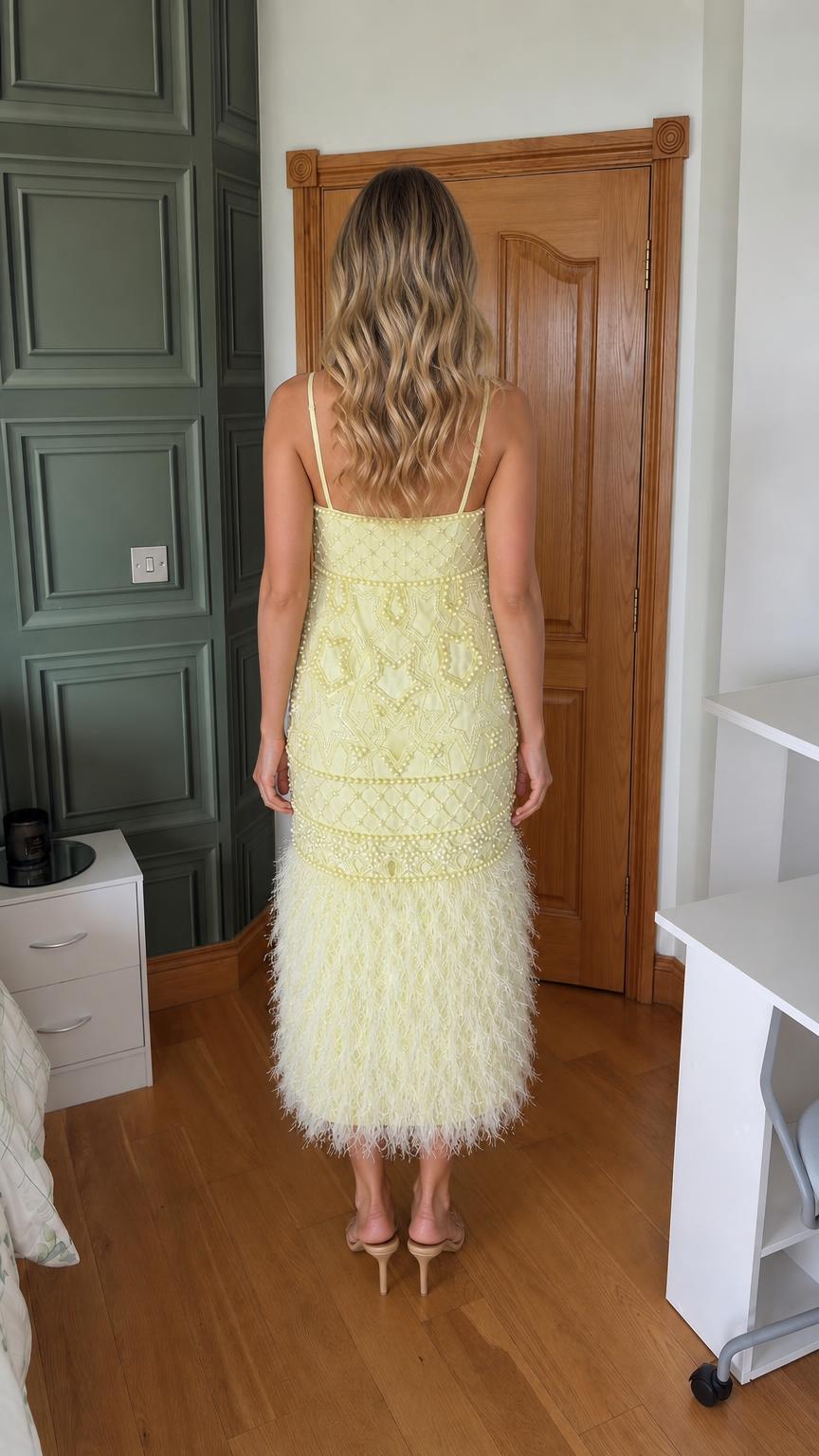 Back view of yellow embellished midi dress