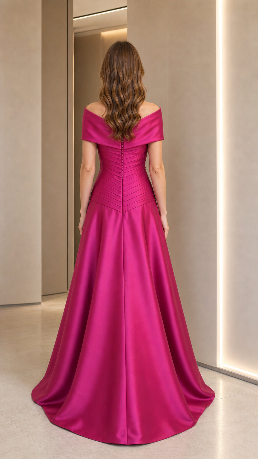 Back view of fuchsia evening gown showing zipper and drape