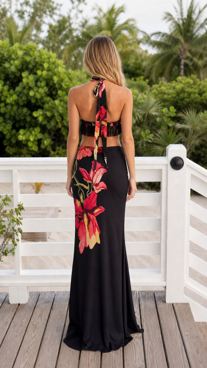 Back view of model wearing black floral two-piece set with halter ties