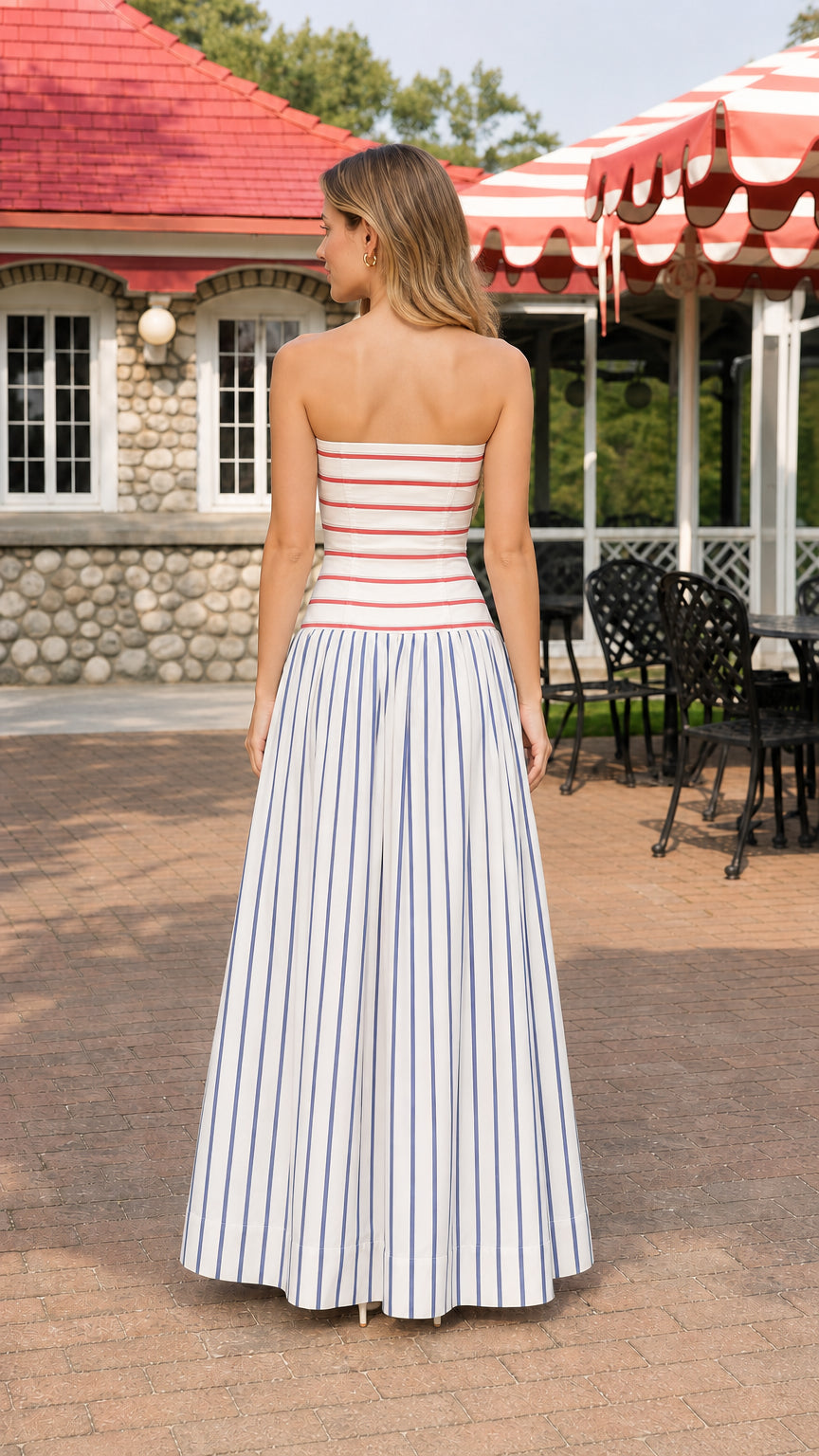 Model wearing blue and white striped strapless maxi dress, back view