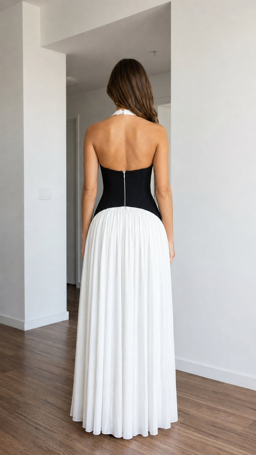 Back view of white halter pleated maxi dress