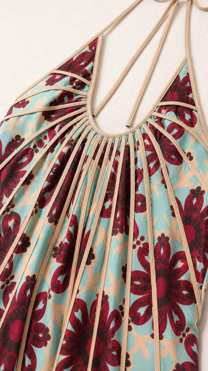 Close-up of halter neckline and pleated fabric details