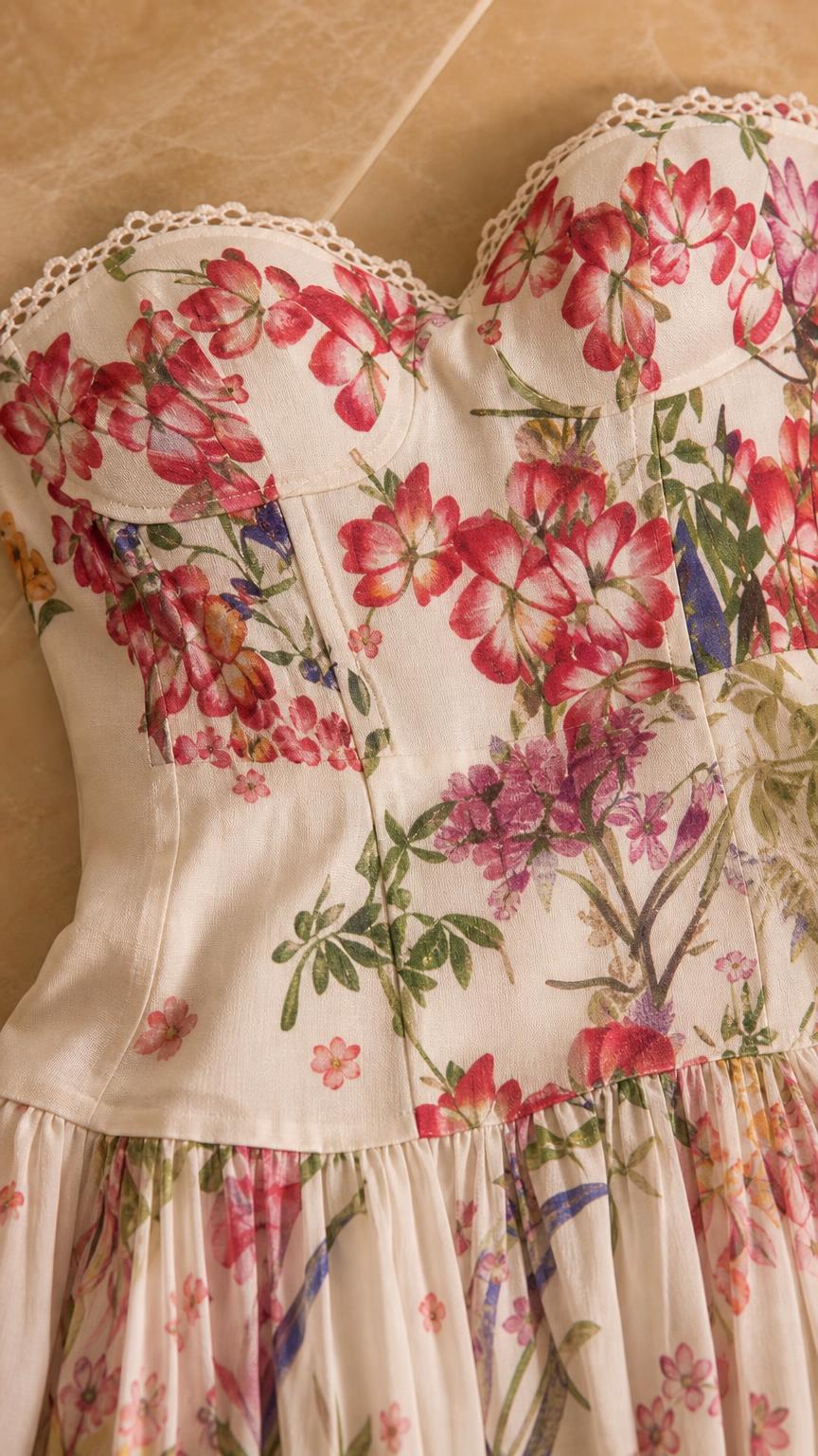 Close-up detail of structured corset bodice and floral print