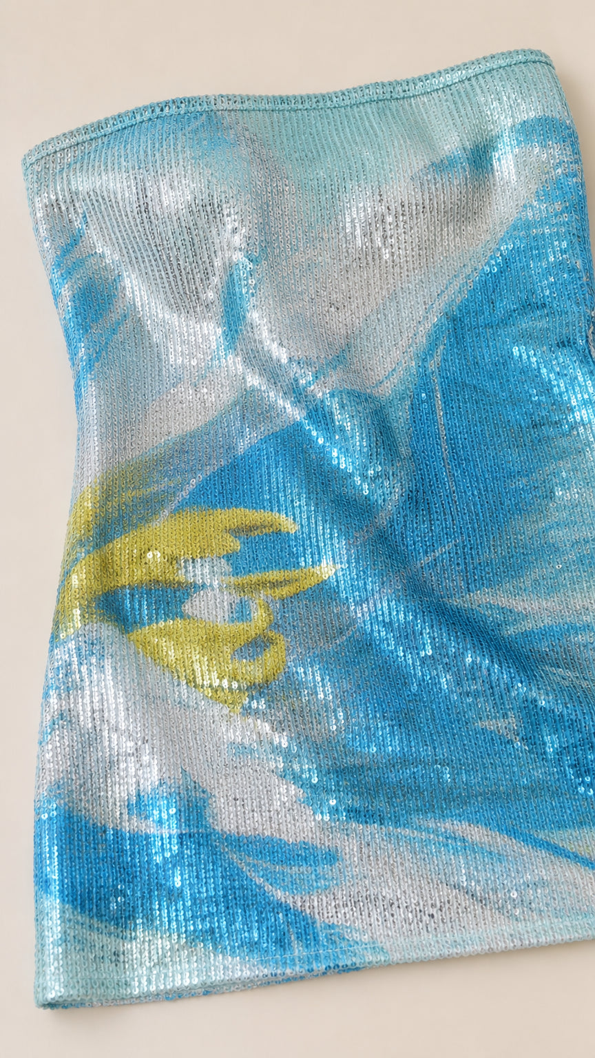 Close-up of blue sequin fabric texture and abstract design