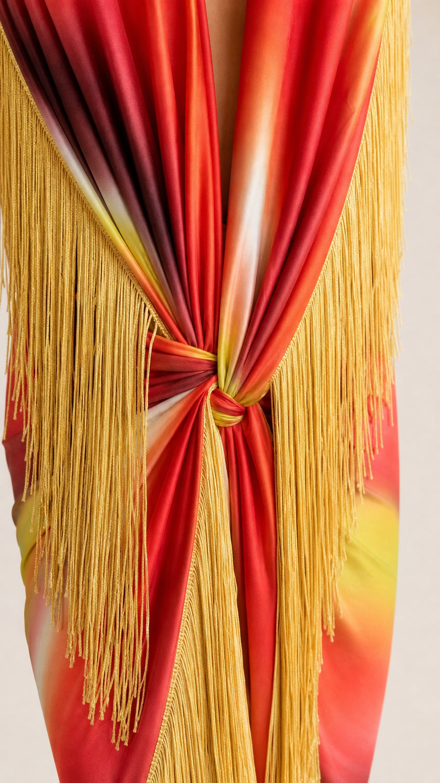 Close-up detail of front knot and cascading fringe trim
