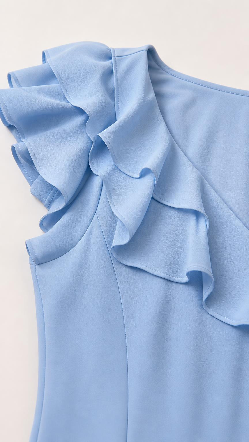 Close-up detail of the ruffle cap sleeve and smooth fabric in Light Blue