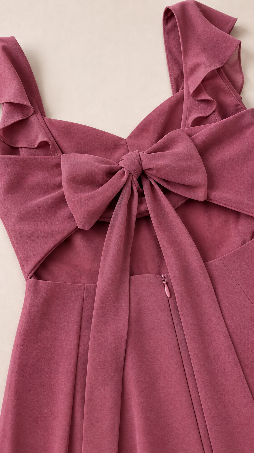 Close-up detail of ruffle straps and back bow