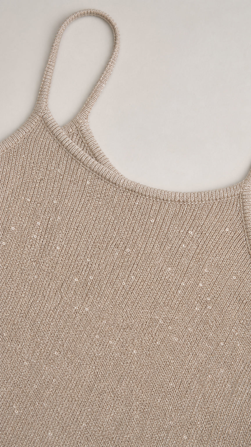 Close-up detail of the textured metallic champagne fabric and scoop neck