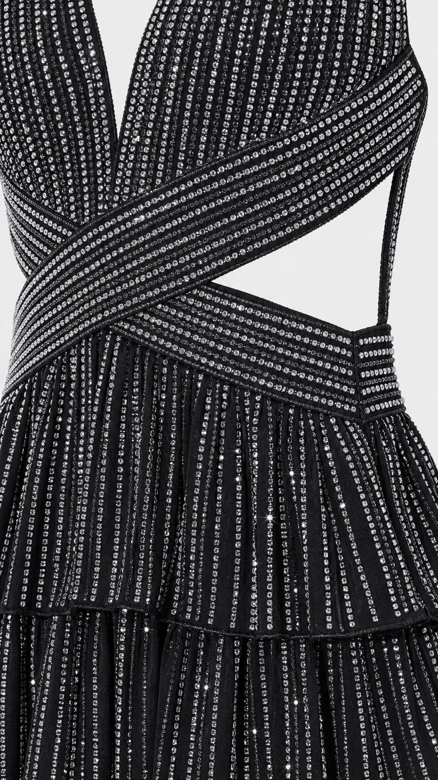 Close-up detail of black glitter crisscross bodice and fabric texture