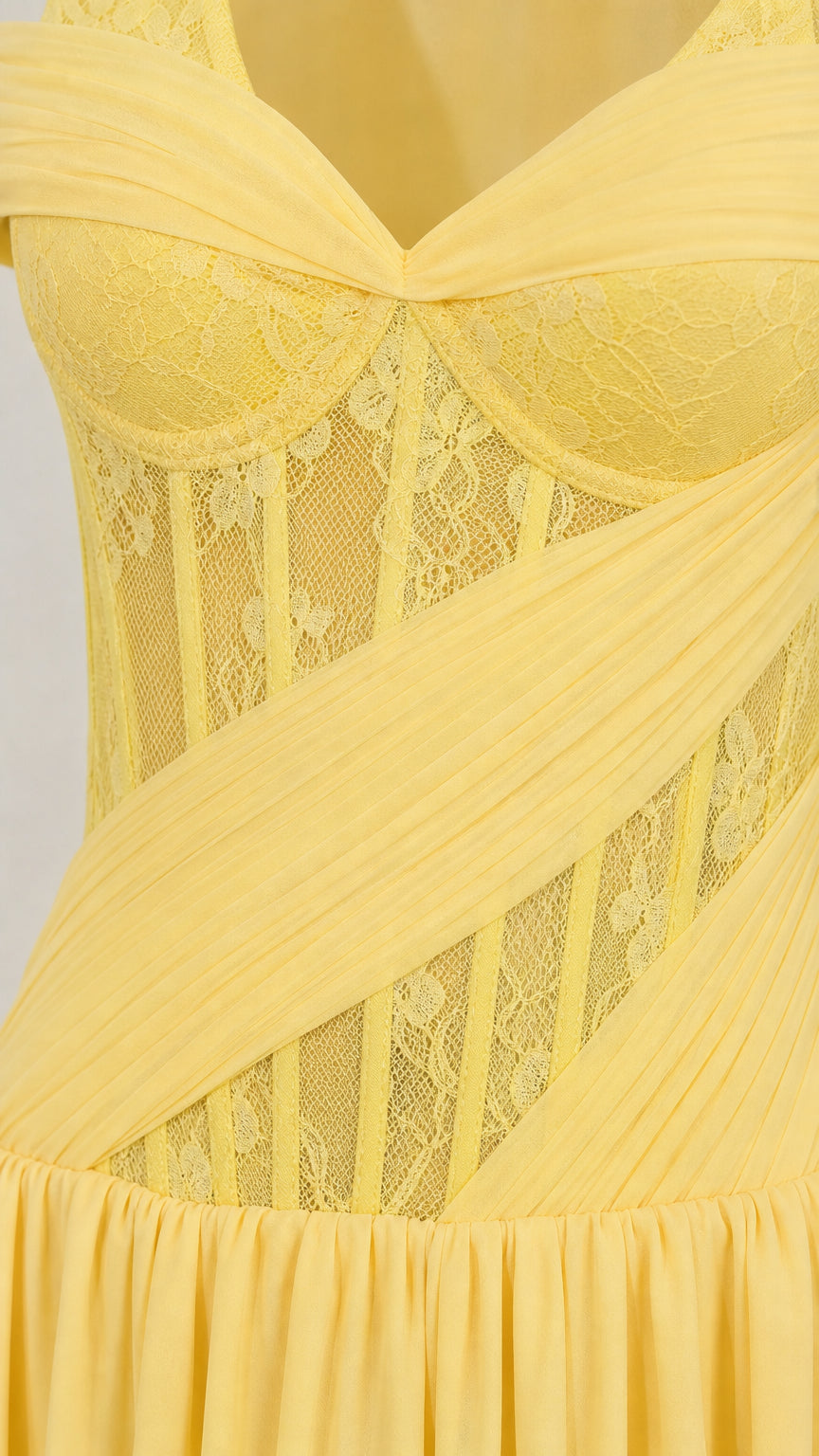 Close-up of yellow sheer lace corset bodice