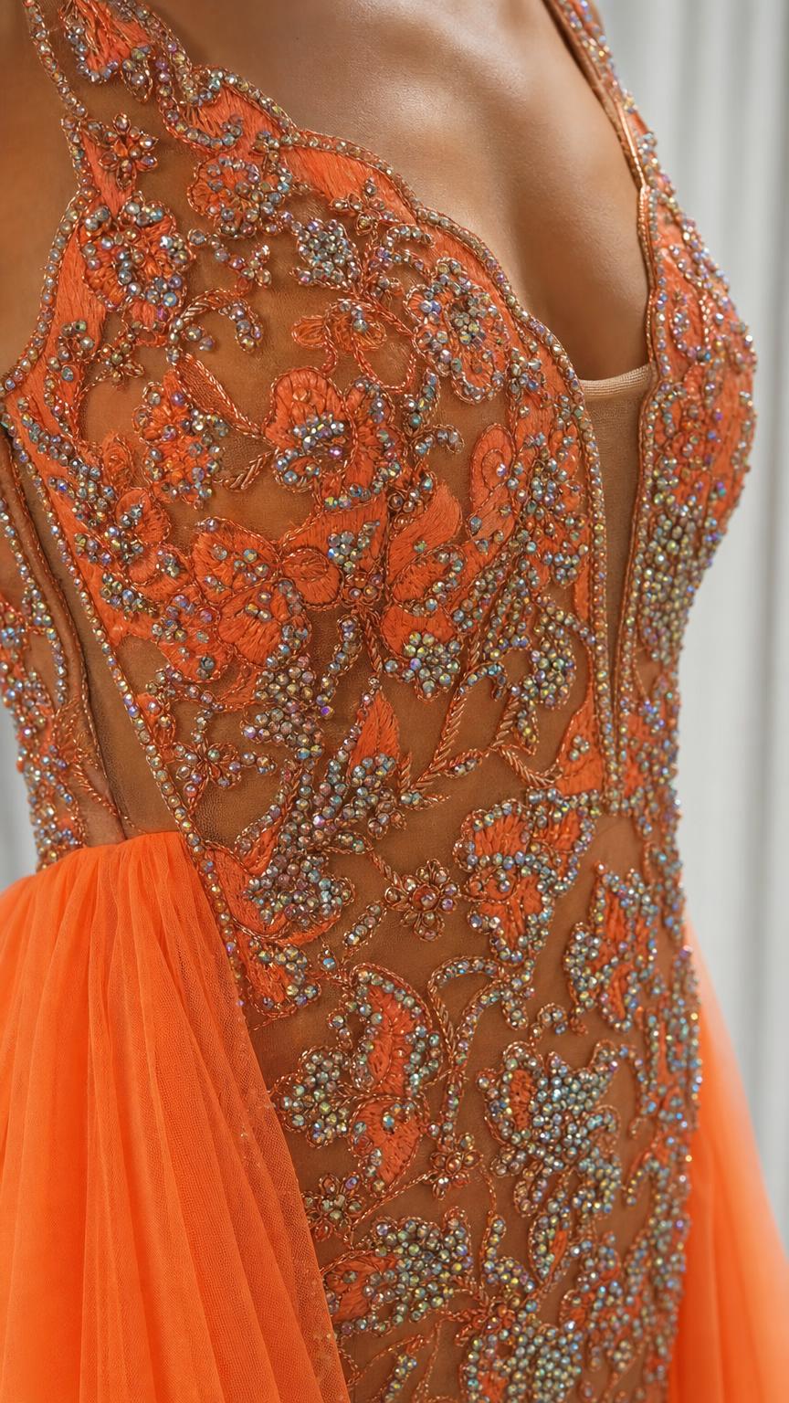 Close-up detail of the intricate beadwork and illusion V-neckline on the bodice