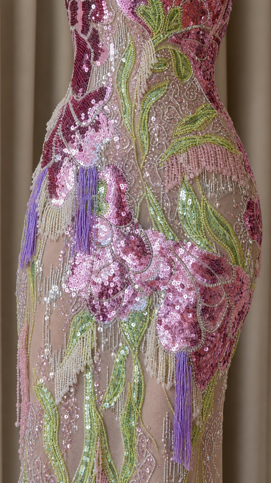 Close-up detail of sequin and bead embroidery on gown