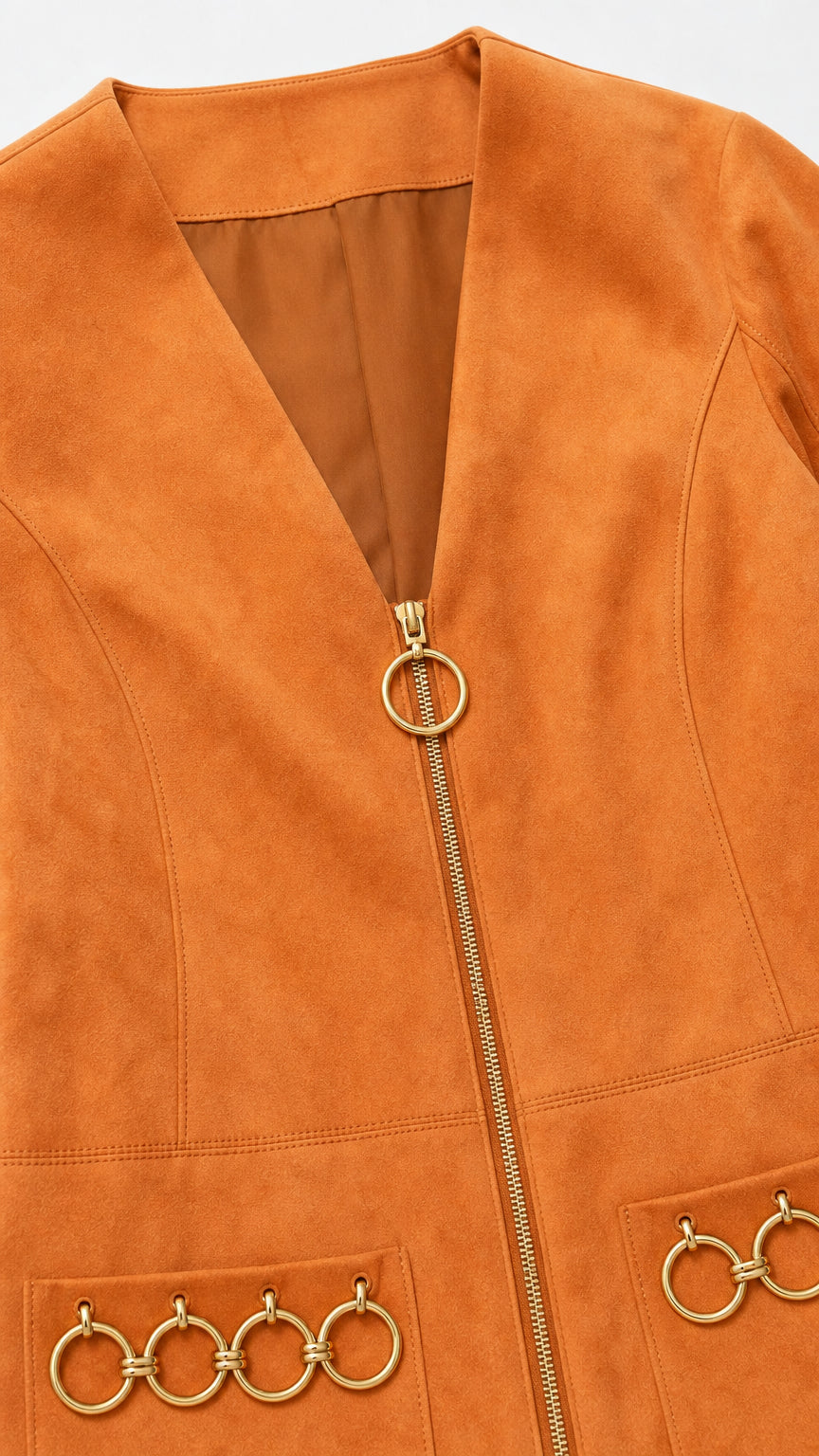 Close-up of zipper and O-ring pocket details on camel dress