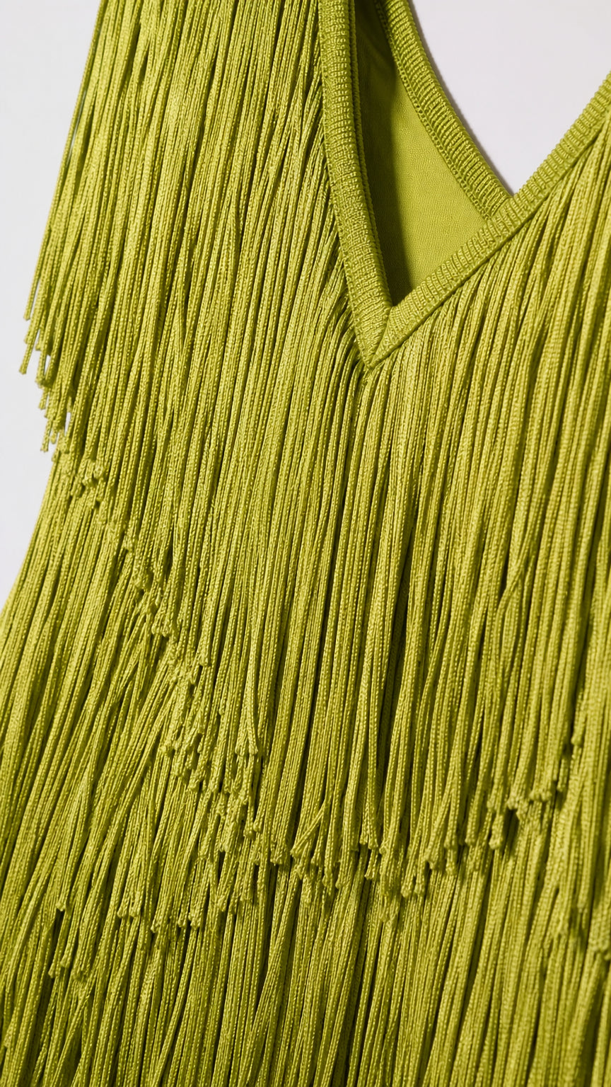 Close up of lime green fringe texture and V neckline