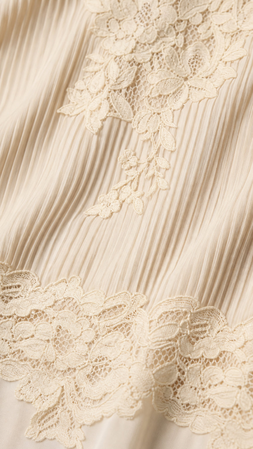 Close-up detail of pleated fabric and floral lace trim
