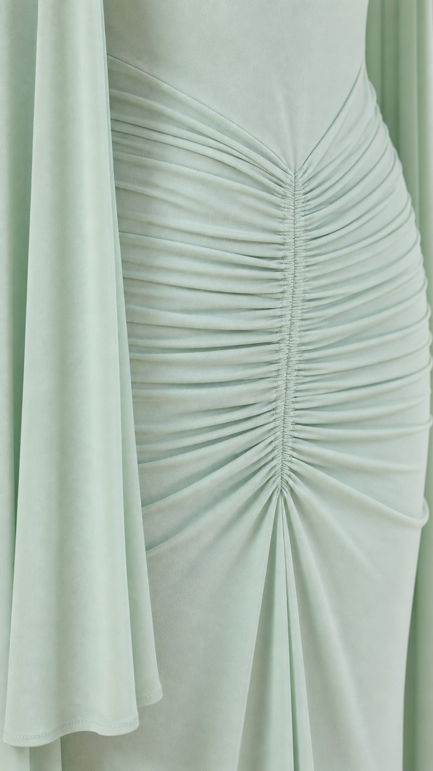 Close up of front ruching and cape detail in sage green
