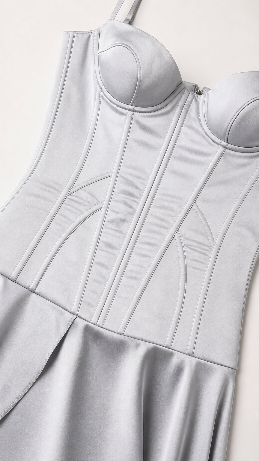 Close-up of silver satin-like corset bodice showing sweetheart cups and vertical panel seams
