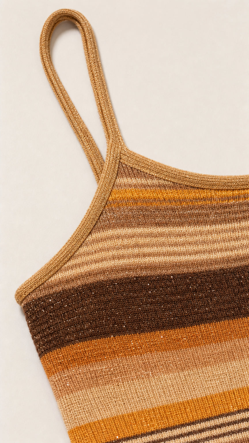 Close-up detail of strap and knit texture on camel dress