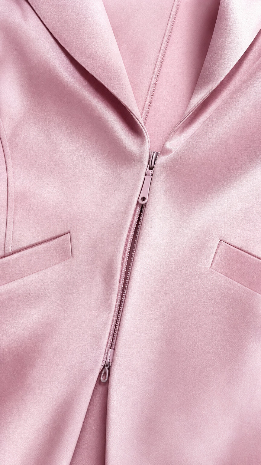 Close-up detail of blazer collar and front zipper closure