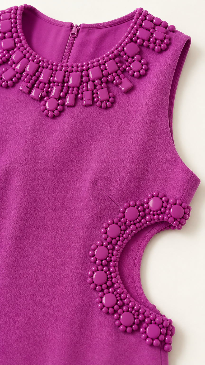 Close-up of beaded neckline and side cutout details