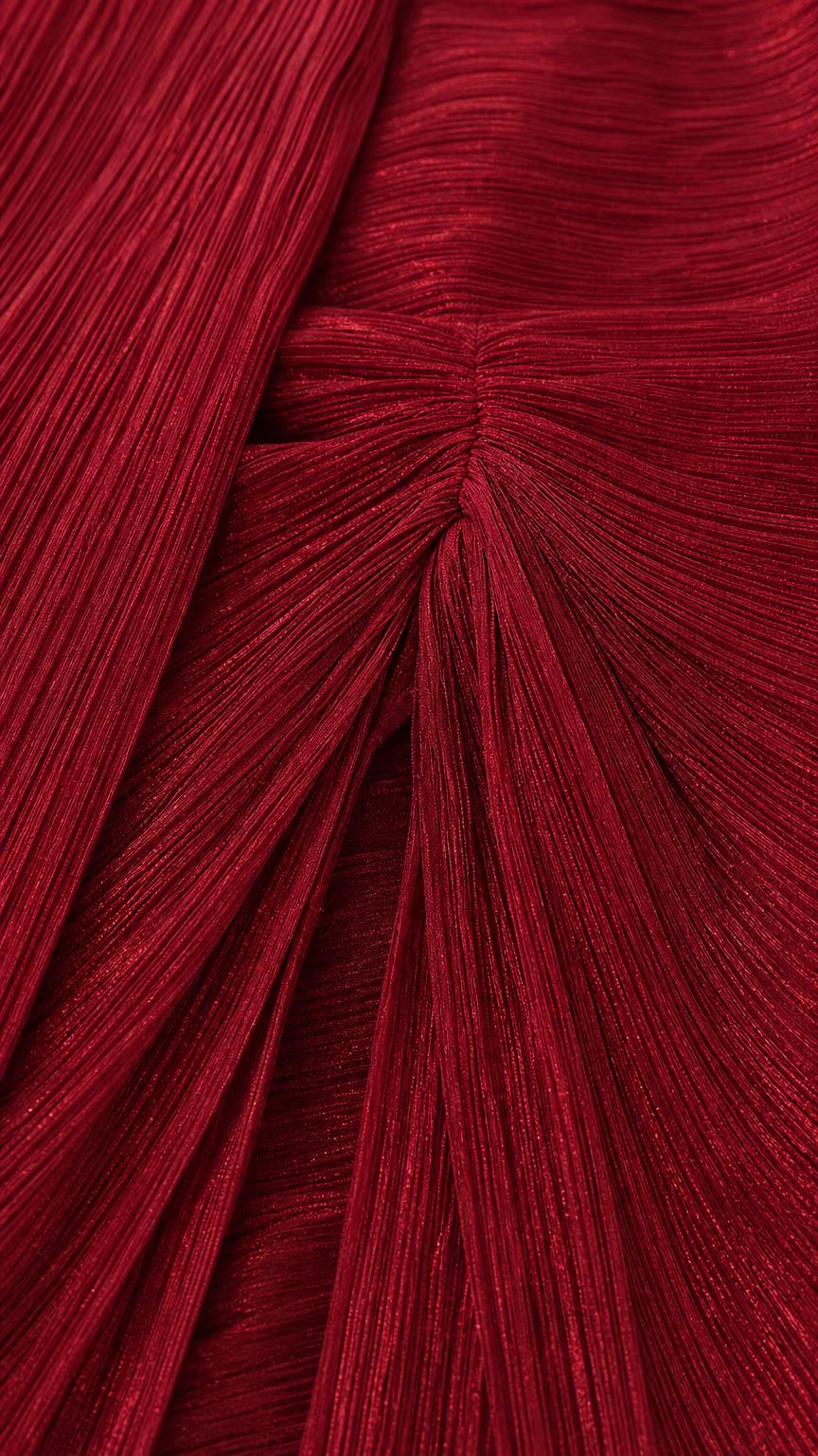 Close-up texture detail of burgundy pleated fabric