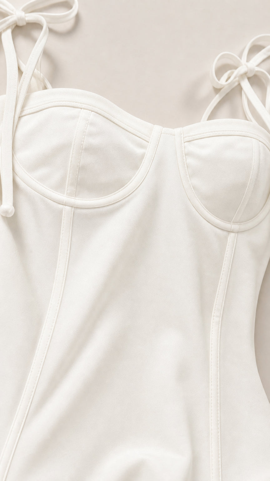 Close-up detail of structured sweetheart bodice and tie straps