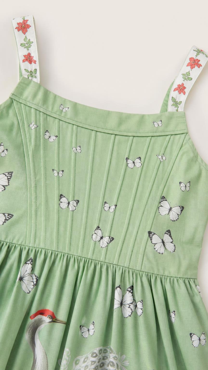 Close-up detail of bodice and embroidered straps