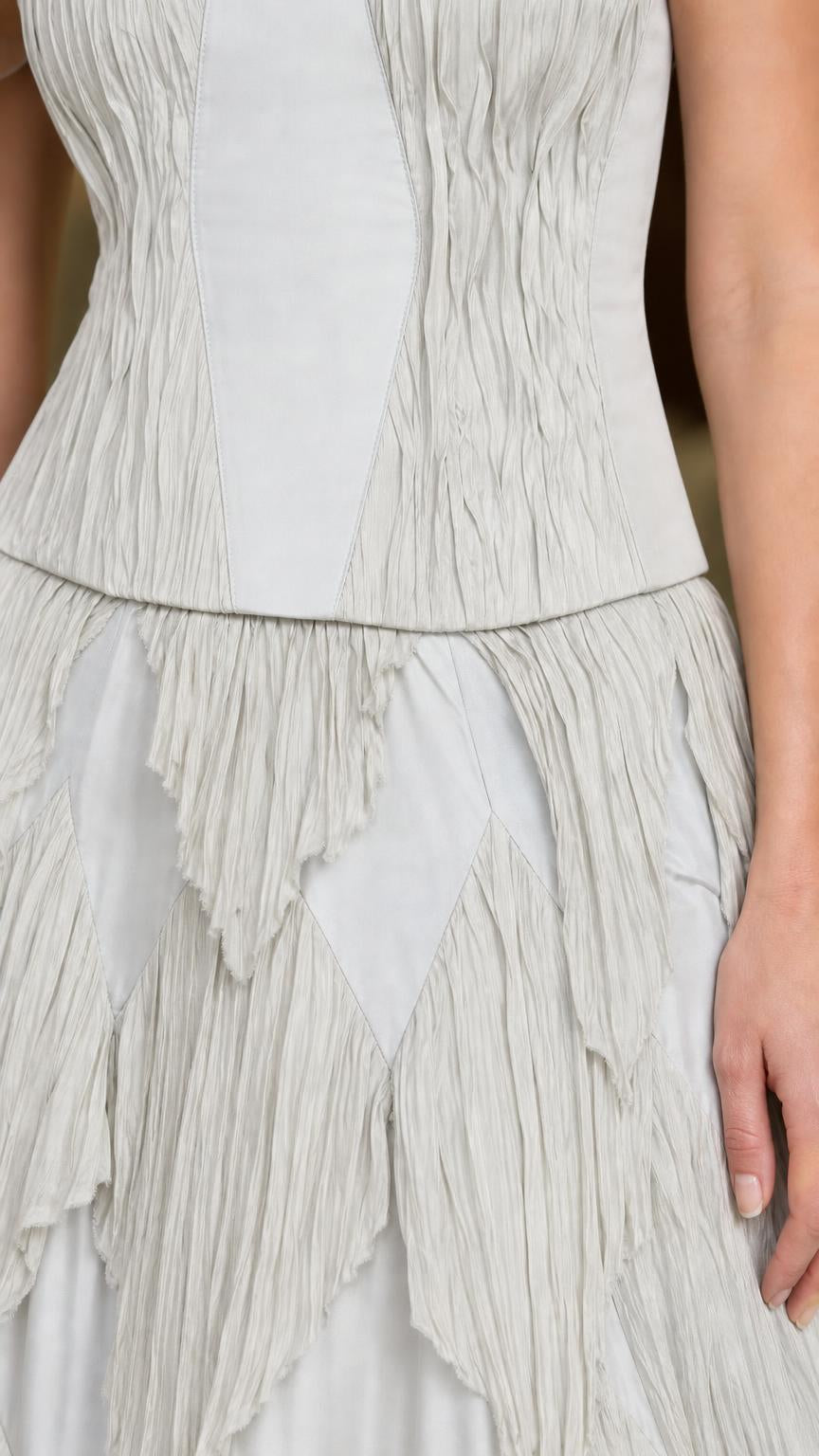 Close-up of bodice and tiered skirt details in light grey