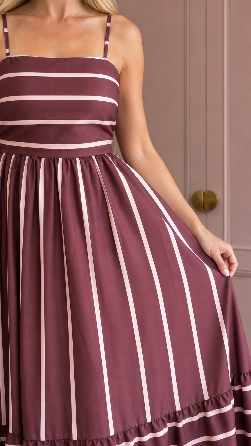 Close-up of bodice and striped pattern on burgundy maxi dress