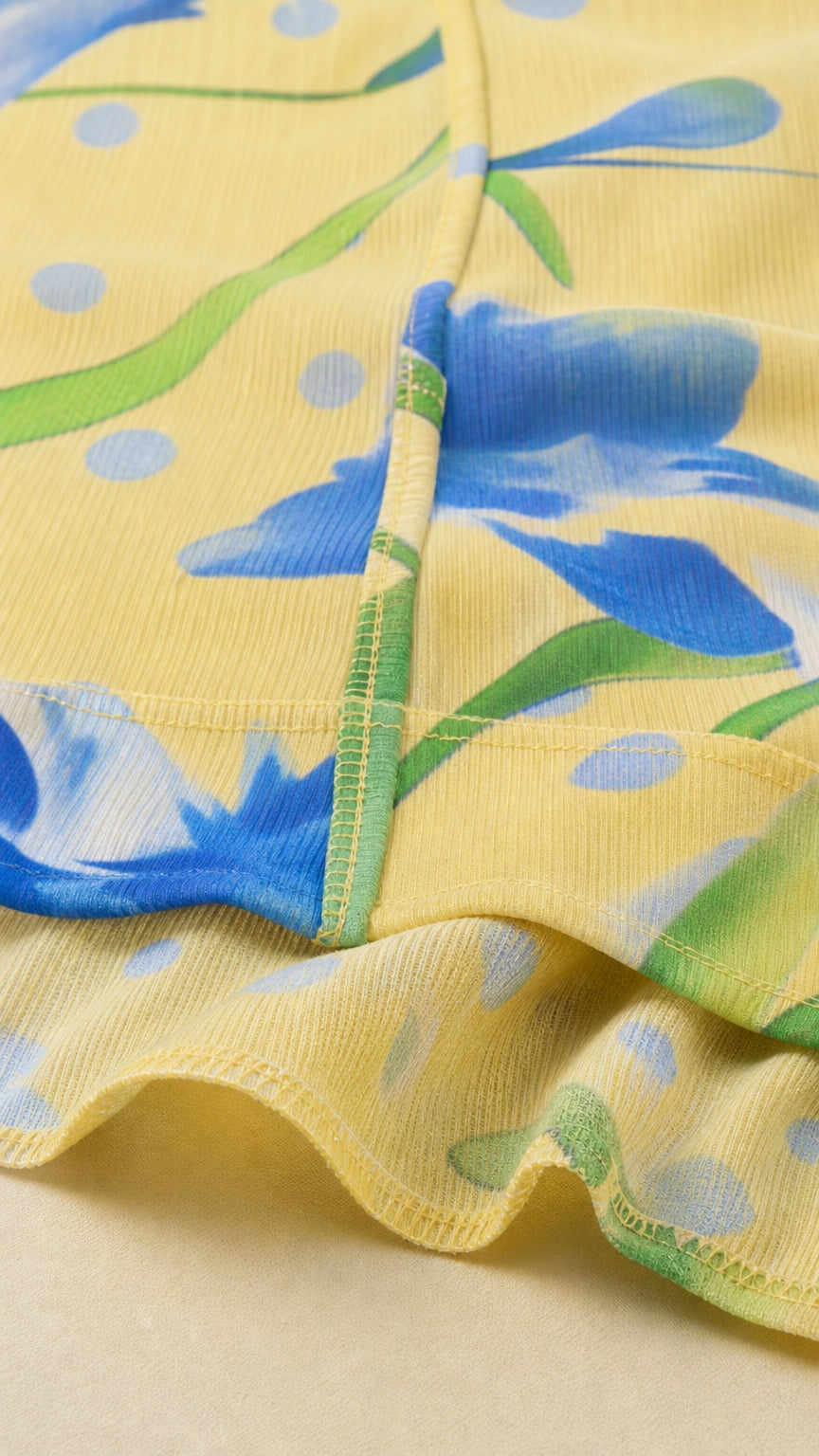 Close-up of yellow floral textured fabric