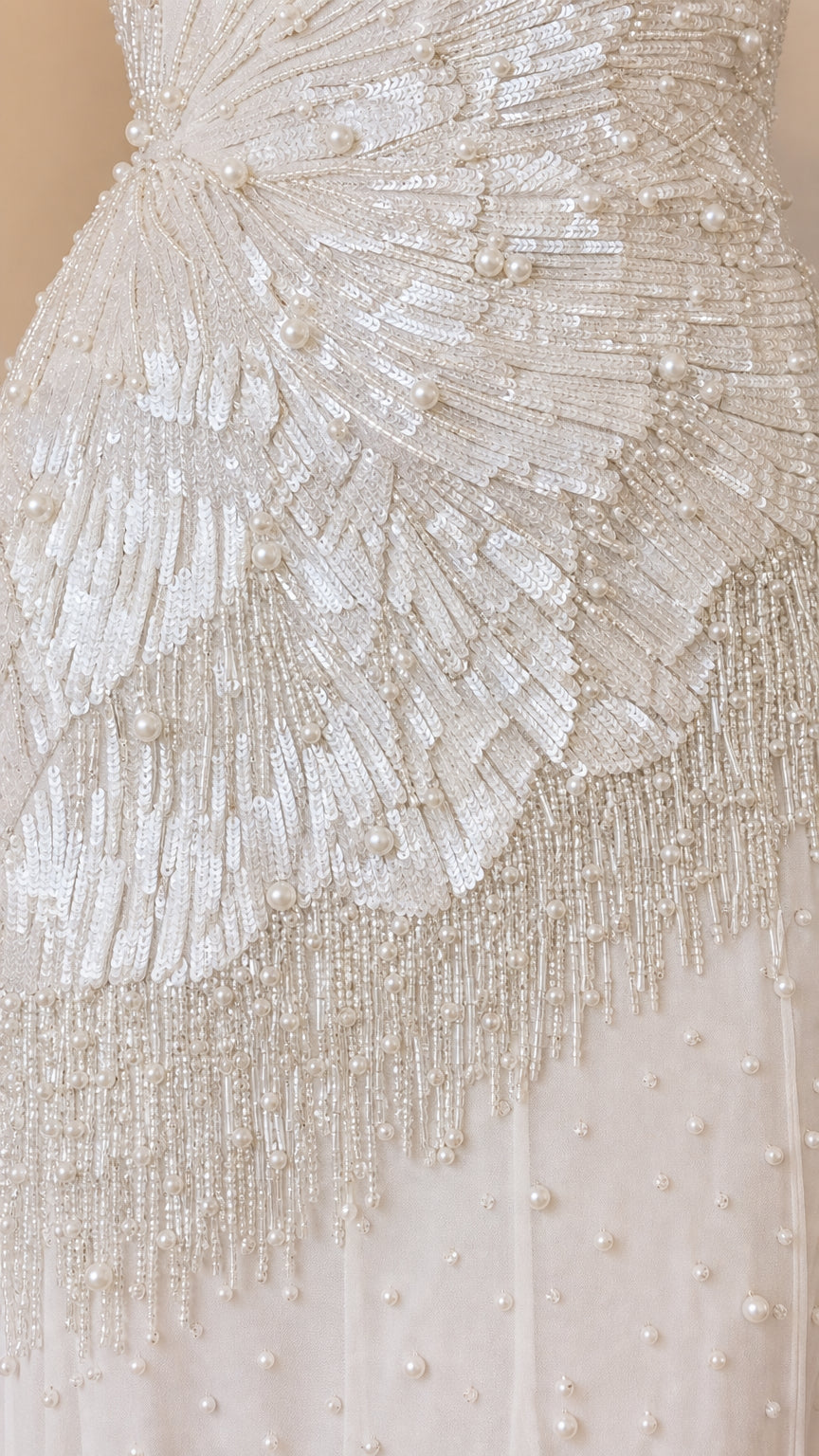 Close up of intricate sequin and pearl beadwork on bodice