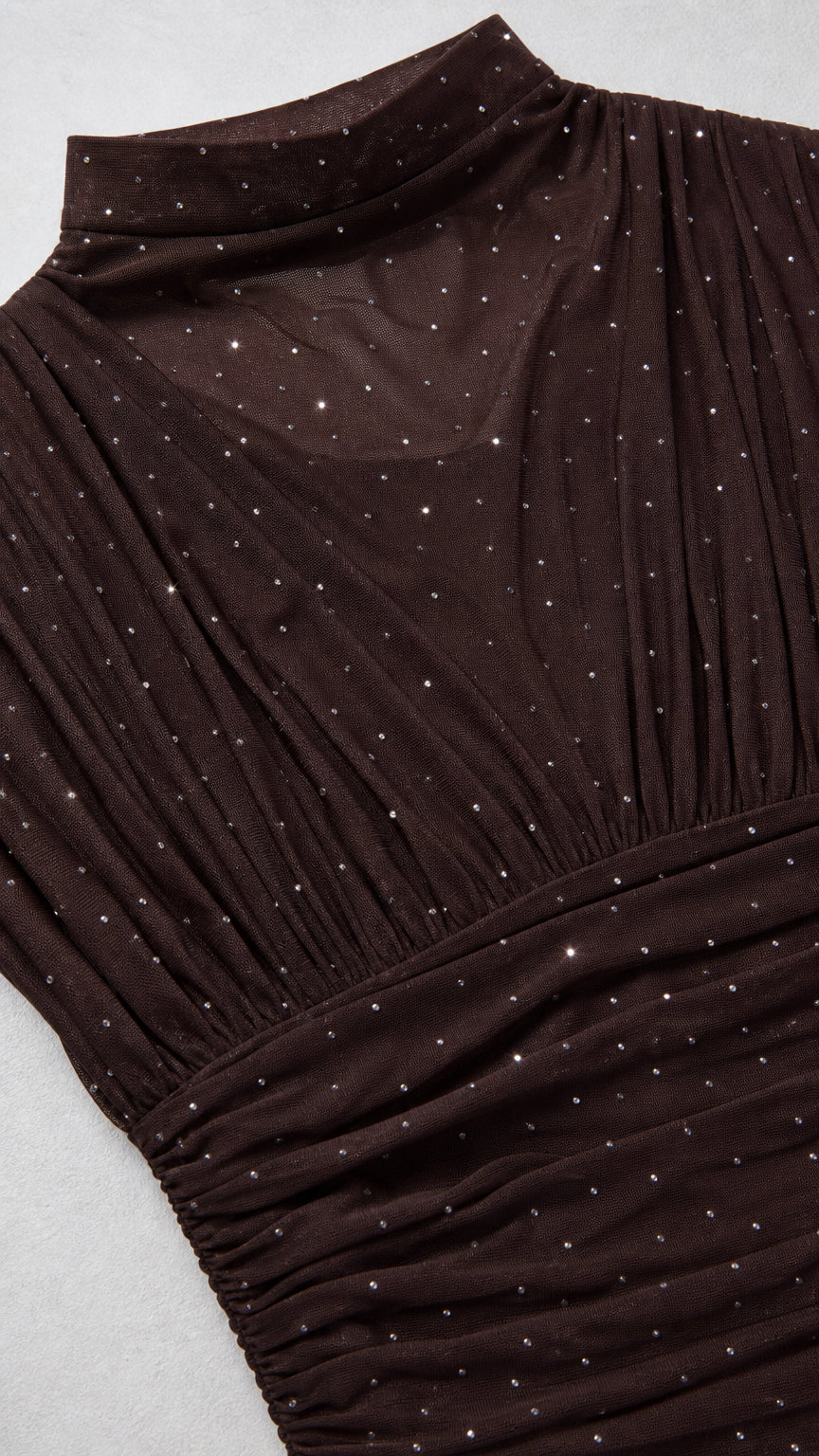 Close-up detail of mock neck and sparkly fabric texture