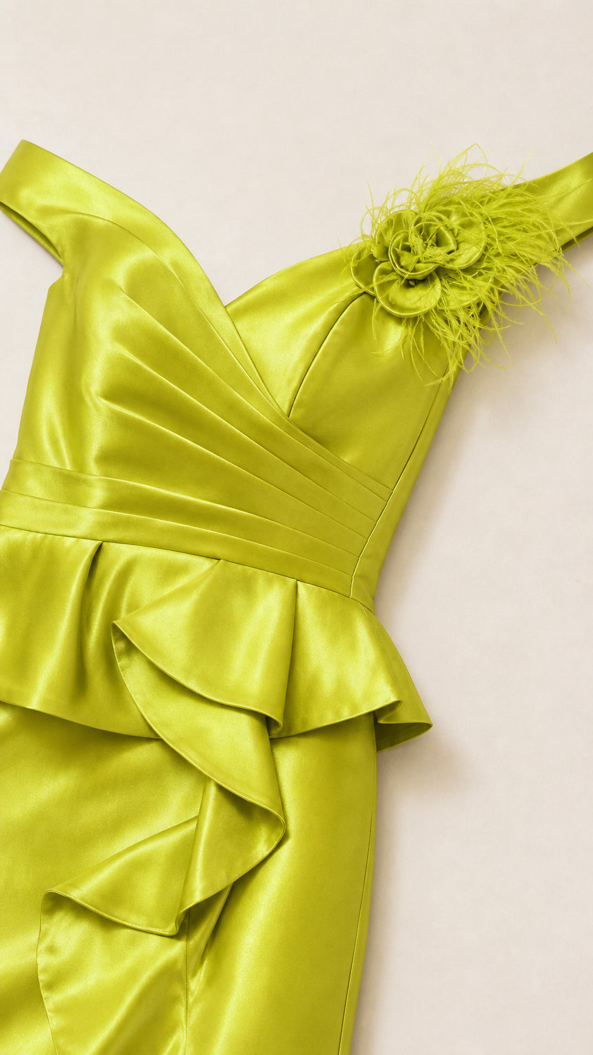 Close up of bodice with feather detail on lime green dress