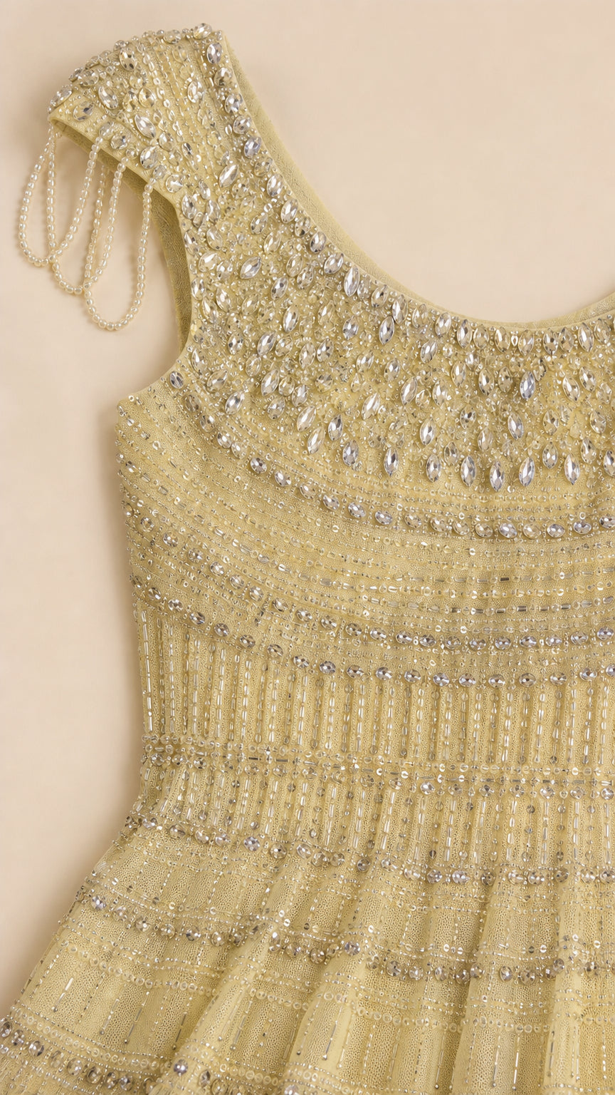 Close-up of crystal and bead embellished bodice on yellow gown