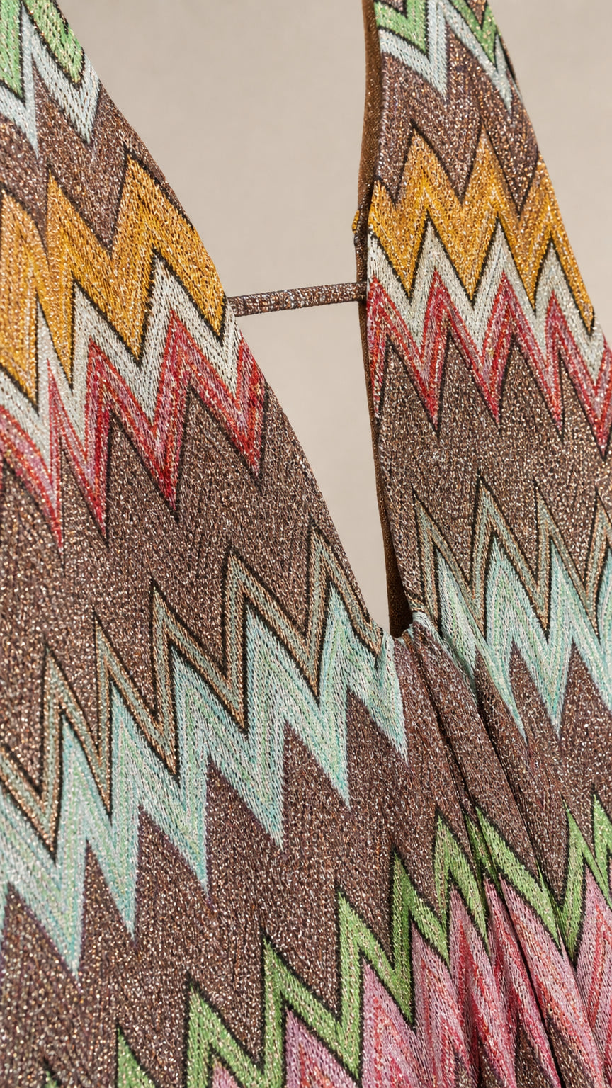 Close-up detail of metallic chevron knit pattern and neckline
