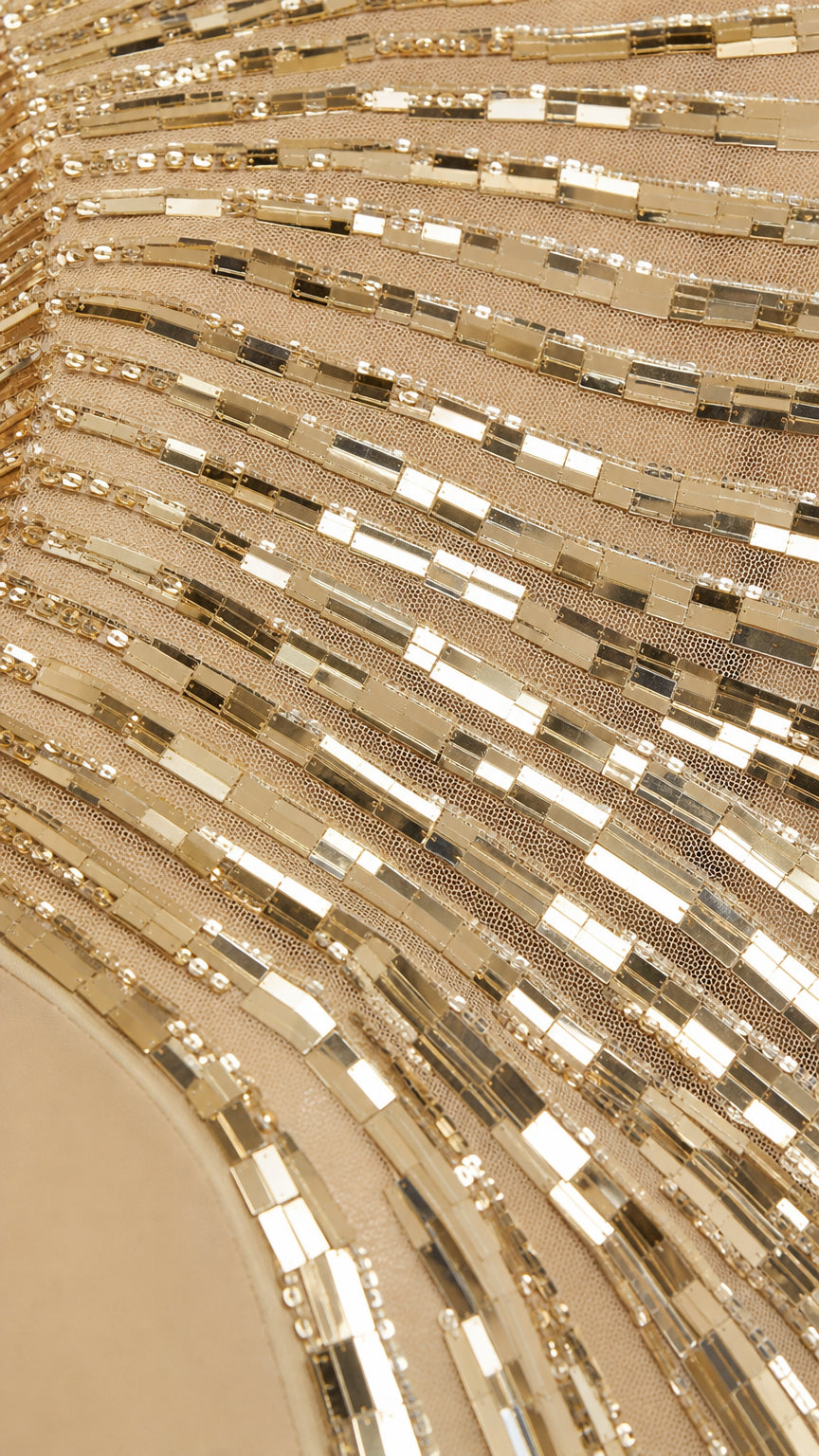 Close-up detail of the linear sequin pattern on mesh fabric